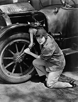 Wrenches: Portrait of female mechanic working