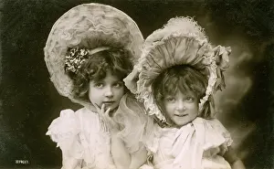 Angelic: Portrait of two girls wearing bonnets