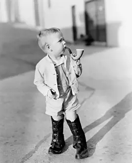 Imitating: Portrait of little boy with pipe