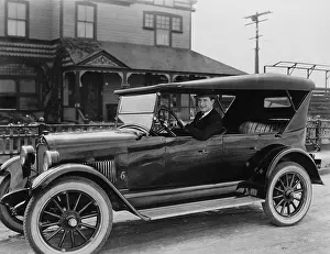 Affluence: Portrait of man in car