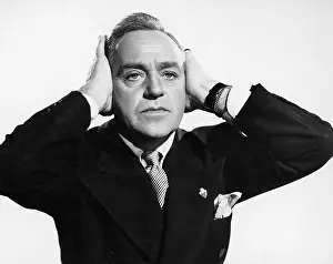 Remorse: Portrait of man covering his ears with his hands