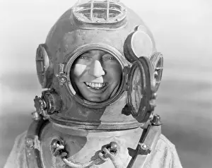 Enclosing: Portrait of man in diving helmet