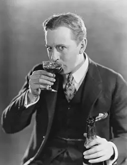 Cautious: Portrait of man drinking