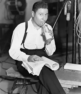 Snacks: Portrait of man drinking bottle of milk