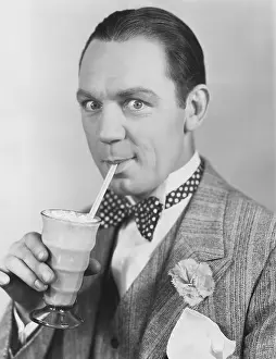 Straws: Portrait of man drinking through straw