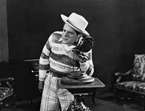 Audio: Portrait of man with ear to microphone