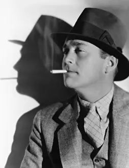 Fedora: Portrait of a man in a fedora with a cigarette in his mouth