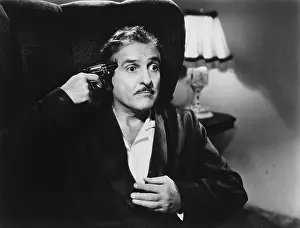 Dread: Portrait of man with gun held to his head