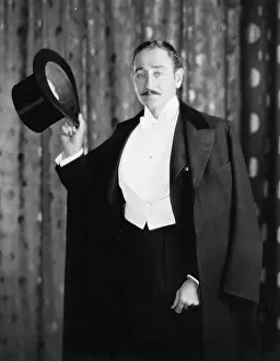 Illusionist: Portrait of a man holding a cylinder