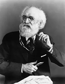 Aging: Portrait of a man holding a knife and pen