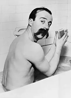 Tubs: Portrait of man with huge mustache in bath