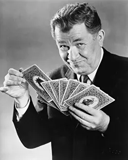 Oversize: Portrait of man with large cards