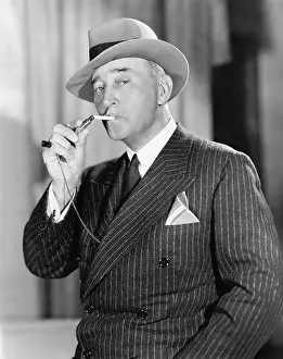 Fedora: Portrait of man lighting cigarette