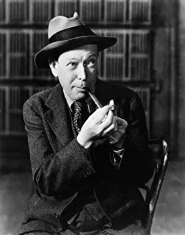 Fedora: Portrait of man lighting pipe