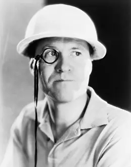 Eyesight: Portrait of man with monocle and helmet