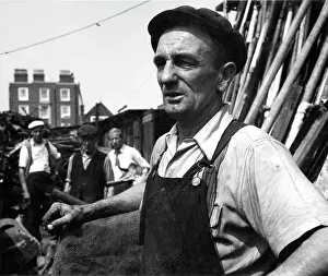 Hessian: Portrait of man in overalls in scrapyard