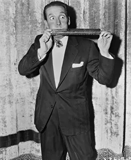 Harmonica: Portrait of man playing huge harmonica