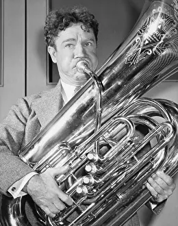 Tubas: Portrait of man playing tuba