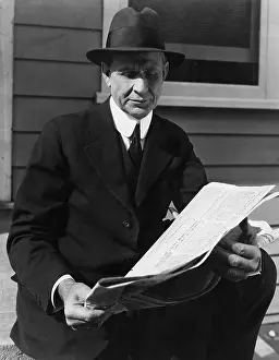 Informative: Portrait of man reading newspaper