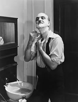 Razors: Portrait of man shaving