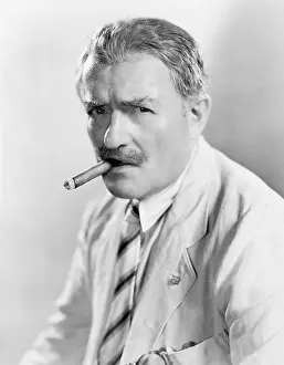 Skeptic: Portrait of man smoking cigar