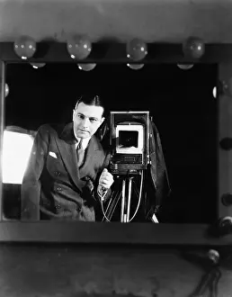 Self Portrait: Portrait of a man standing with a large format camera