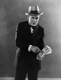 Fedora: Portrait of man with stock certificates
