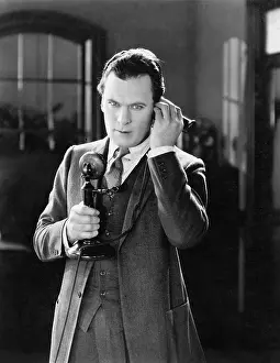 Concentrate: Portrait of a man talking on the telephone