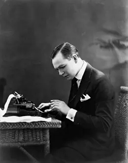 Professionals: Portrait of man using typewriter