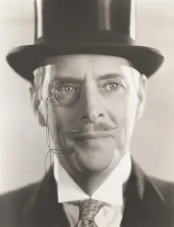 Classy: Portrait of man wearing monocle and top hat