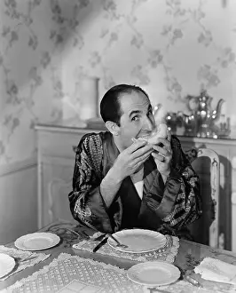 Foodstuff: Portrait of a mature man sitting at the dining table