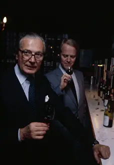 Sampling: Portrait -- two men sampling wine