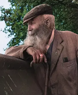 Comb: Portrait of an old man with beard and walking stick
