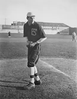 Pitching: Portrait of pitcher on baseball field