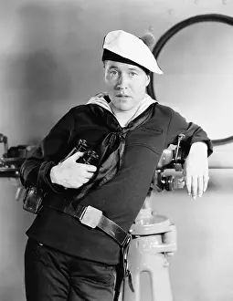 Nonchalant: Portrait of sailor with binoculars