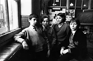 Variations: Portrait of four schoolboys in a classroom