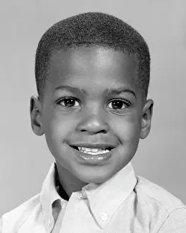 Sincere: Portrait Smiling African-American Boy looking at Camera