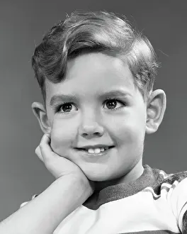 Sincere: Portrait Smiling Boy Looking at Camera Face Resting in