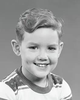 Dimples: Portrait Smiling Boy Looking at Camera Wearing Striped