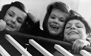 Banister: Portrait of three smiling children