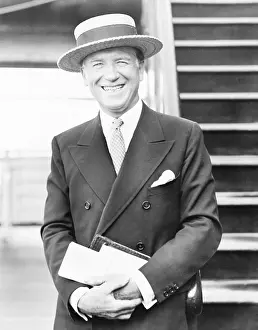 Vivacious: Portrait of a smiling man with a straw hat