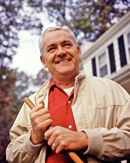 Retiree: Portrait or Smiling Senior Man Outdoors in Front