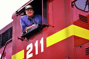 Deg002: Portrait of Train Engineer Leaning Out of Train Cab Window