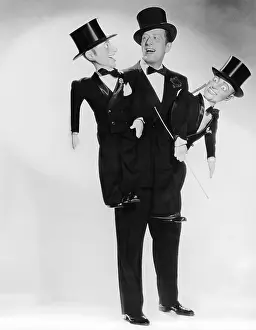 Ventriloquist: Portrait of ventriloquist with two dummies