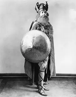 Valor: Portrait of a Viking warrior standing and holding a shield