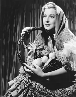 Bountiful: Portrait of woman with basket of fruit