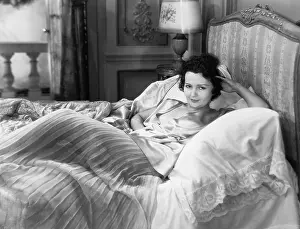 Indulge: Portrait of woman in bed