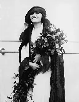 Thoughtfulness: Portrait of woman with bouquet