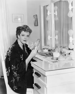 Interrupting: Portrait of woman at dressing table