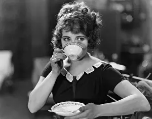Teacup: Portrait of woman drinking from teacup